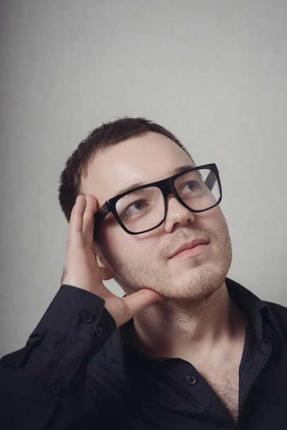 thinking guy in eyeglasses - Фото, зображення