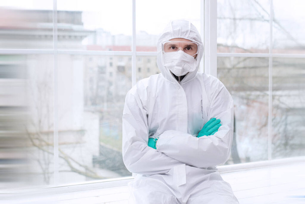 Safety virus infection concept. Man in protective suit. - Fotó, kép