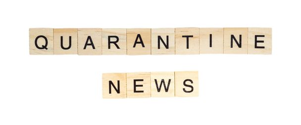 The words "Quarantine News" spelt out with letter tiles on the white background - Valokuva, kuva