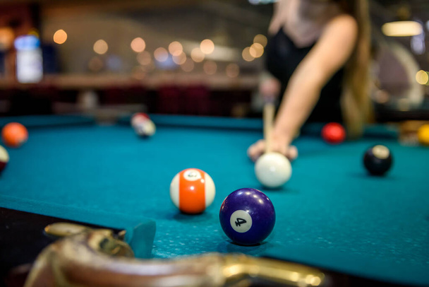 Selective focus at billiard ball on blue table - Photo, image