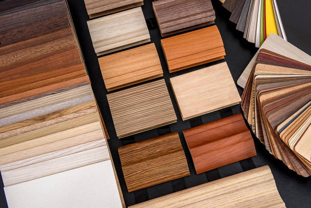Plywood sampler in fan at wooden desk close up - Photo, Image