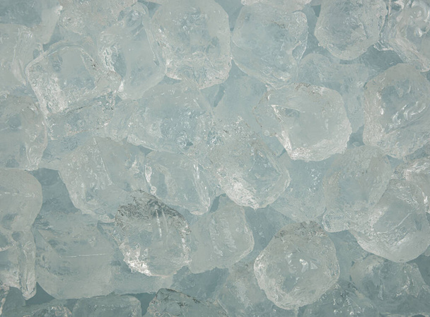 Close up background texture of clear ice cubes and rocks, directly above - Photo, Image