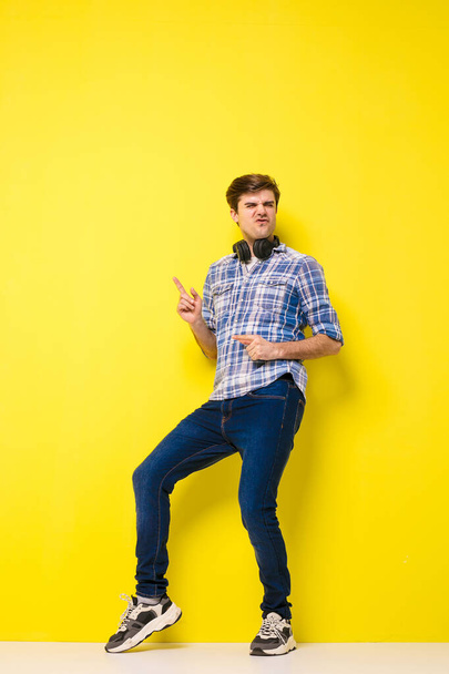 rock star person, cool funny men dancing on yellow background - Фото, изображение