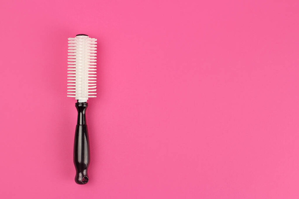 Children's plastic comb on pink background, layout with copy space - Photo, Image