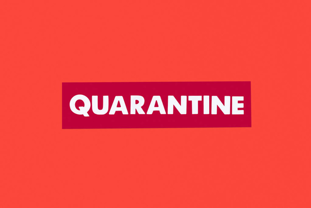 top view of quarantine lettering isolated on red  - Foto, imagen