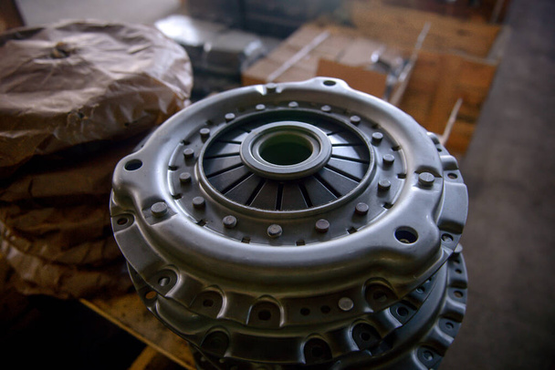 Clutch disc and clutch basket. Stock of spare parts for cars. clutch plate car expire. - Photo, Image