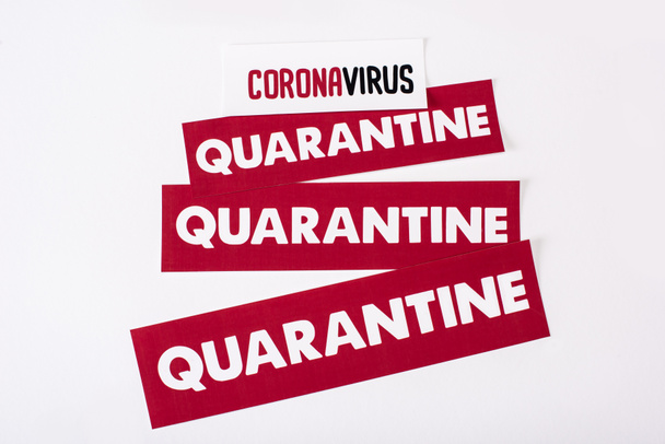 top view of red cards with quarantine and coronavirus lettering isolated on white  - Foto, immagini