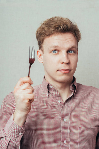 man with a fork - Foto, immagini