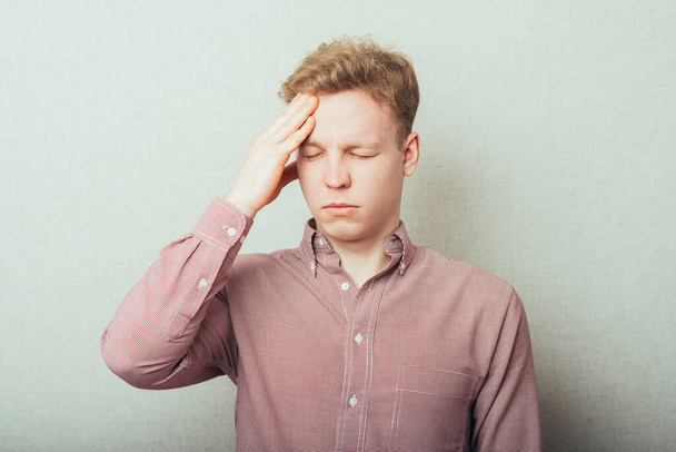 man has a headache - Фото, изображение