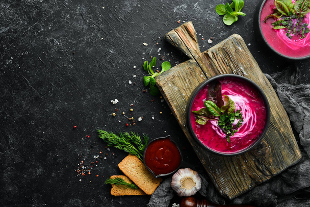Red beet soup with sour cream. Ukrainian cuisine, Borsch soup. Top view. Free space for your text. Rustic style. - Foto, afbeelding