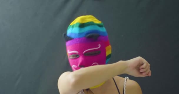 Young Latin Woman is Using a Mask of Various Colors and Coughs into her Arms. She is Very Sick with Coronavirus Symptoms - Filmagem, Vídeo
