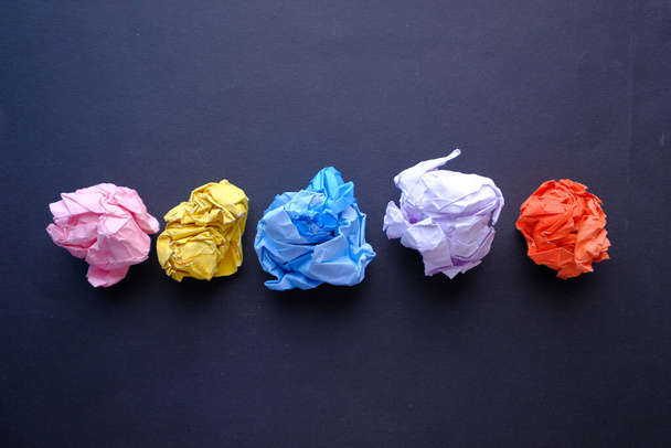 top view of crumpled paper ball on black background  - 写真・画像