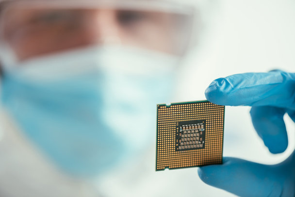 selective focus of engineer holding computer microchip - Photo, Image
