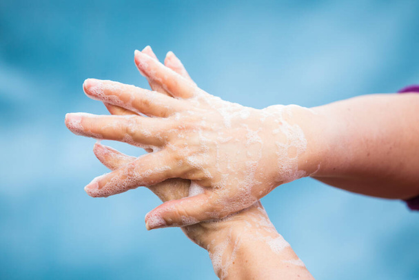 Coronavirus spread prevention by washing hands - Foto, imagen
