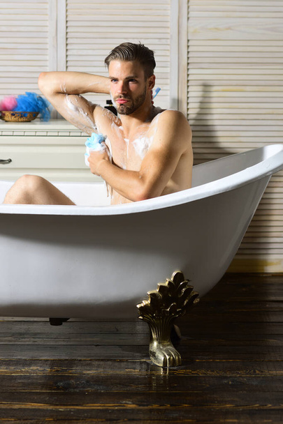 Sexuality and relaxation concept: guy with bristle taking bath - Zdjęcie, obraz