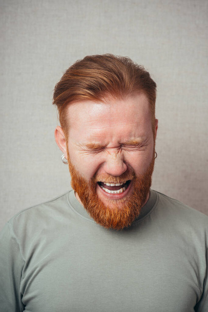 Portrait Of A Man Shouting On Grey Background - Photo, image