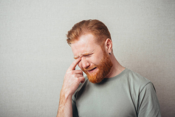Emotional handsome Young hipster red bearded  crying - Fotografie, Obrázek