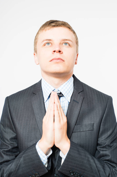 young businessman praying with his hands set in pray - Foto, Imagem