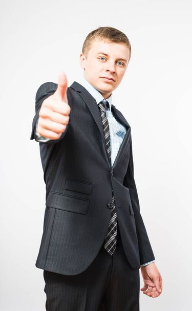  man giving thumbs up sign - 写真・画像
