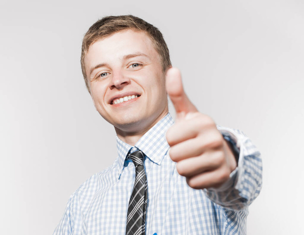 Handsome young business man hold hand with thumb up gesture, businessman excited happy smile, wear elegant shirt and tie isolated over white background - Φωτογραφία, εικόνα