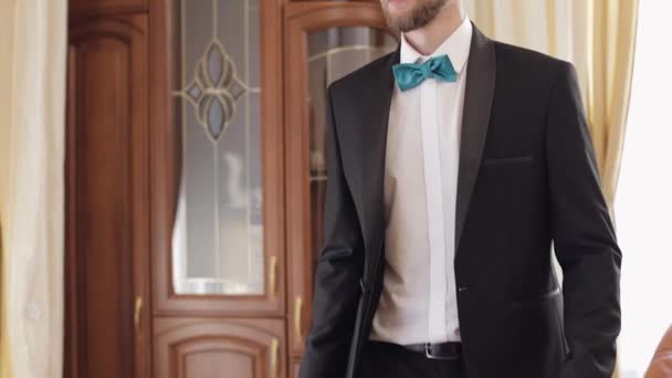 Groom in white shirt and jacket at home. Wedding day. Handsome man - Footage, Video