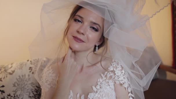 Beautiful and lovely bride in night gown and veil. Wedding morning. Slow motion - Footage, Video