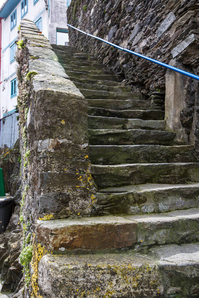 street photography of an old stone staircase filled with moss - Photo, Image