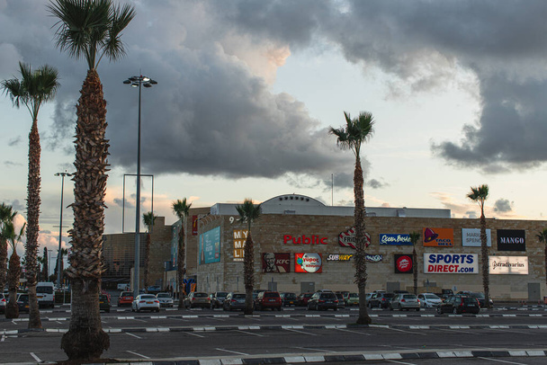 LIMASSOL, CYPRUS - MARCH 31, 2020: my mall limassol shopping centre near palm trees  - Photo, image