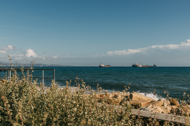 selective focus of ships in blue mediterranean sea against blue sky  - Фото, зображення