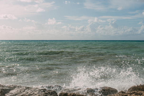 splash of water from mediterranean sea on wet rocks  - Φωτογραφία, εικόνα