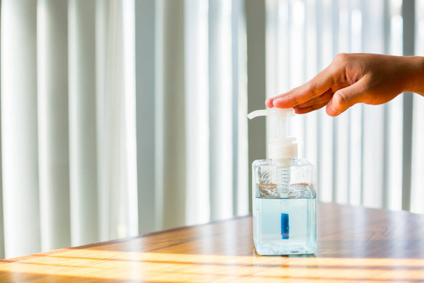 Washing hands with alcohol sanitizer to avoid contamination with Coronavirus Covid-19. Using alcohol gel clean wash hand sanitizer anti virus bacteria dirty skin care. - 写真・画像