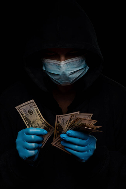 Concept of the global financial crisis. World pandemic virus COVID-19 coronavirus. Panic, black and shadow business and speculation. - Foto, imagen
