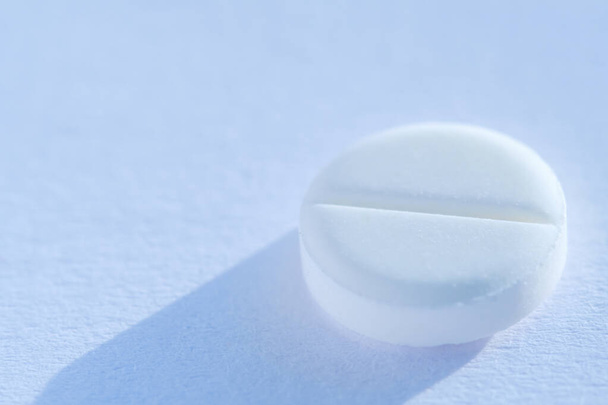 Pill tablet medicine lying isolated on white background extreme close-up macro. - Photo, image