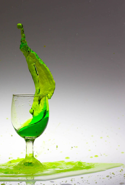 splash of green water inside the glass - Photo, image
