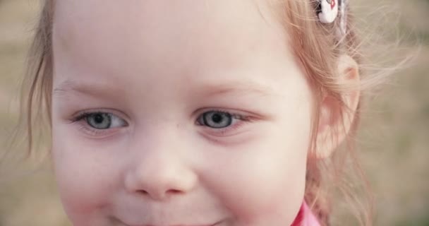 Funny little girl is posing at camera - Footage, Video