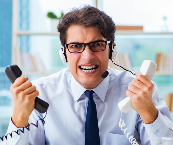 Unhappy angry call center worker frustrated with workload - Photo, Image