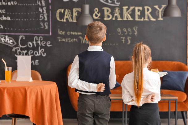 Cute little waiters in restaurant - Photo, Image