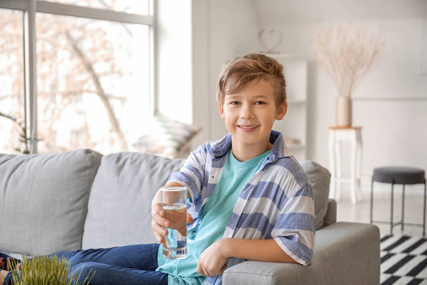 Cute little boy drinking water at home - Fotografie, Obrázek