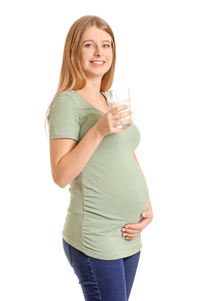 Beautiful pregnant woman with milk on white background - 写真・画像