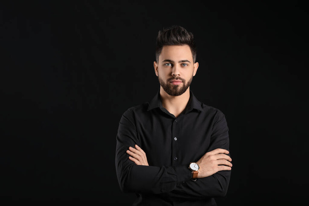 Handsome man with healthy hair on dark background - Photo, Image