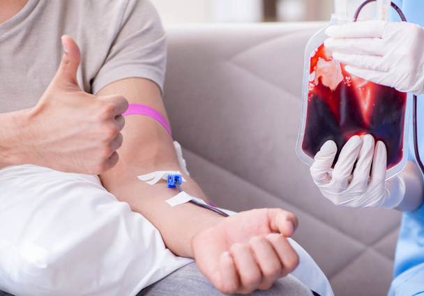 Patient getting blood transfusion in hospital clinic - Photo, Image