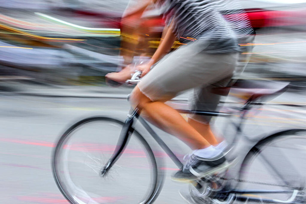 active people on bicycle  in the city roadway  in motion blur - Foto, Imagen