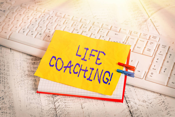 Conceptual hand writing showing Life Coaching. Business photo showcasing Employee employed to help showing attain their goals in career notebook reminder clothespin with pinned sheet light wooden. - Photo, Image