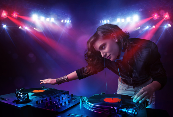 Teenager Dj mixing records in front of a crowd on stage - Photo, Image
