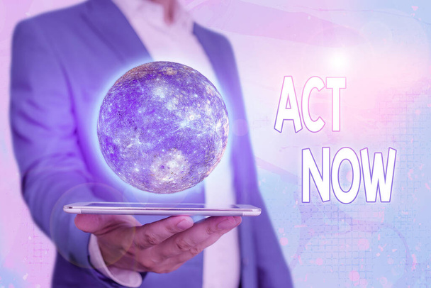 Text sign showing Act Now. Conceptual photo do not hesitate and start working or doing stuff right away Elements of this image furnished by NASA. - Photo, Image