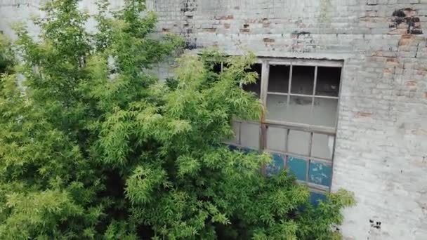 Flying low over abandoned old plant. Ruins of abandoned old broken industrial factory. - Felvétel, videó