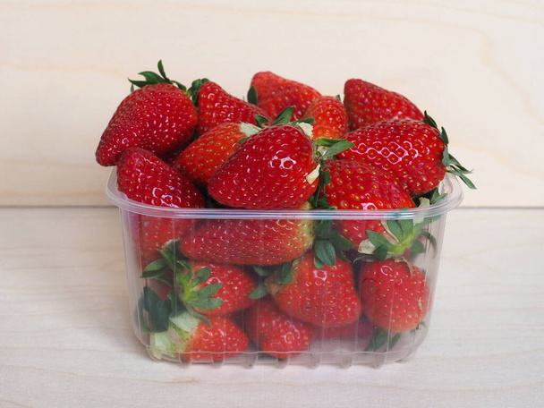basket of strawberries (Fragaria x ananassa) fruits vegetarian food - Photo, Image