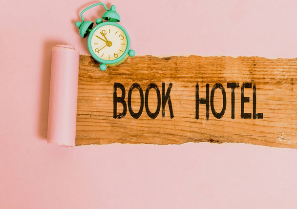 Text sign showing Book Hotel. Conceptual photo an arrangement you make to have a hotel room or accommodation. - Photo, Image