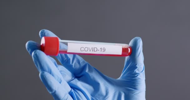 Sample of Covid-19 vaccine in scientisst hands, close up - Filmati, video
