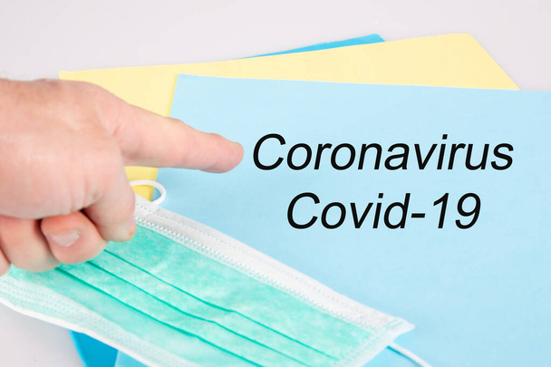 Novel virus coronavirus disease covid-19 2019-nCoV text hand pointing on folder paper - 写真・画像